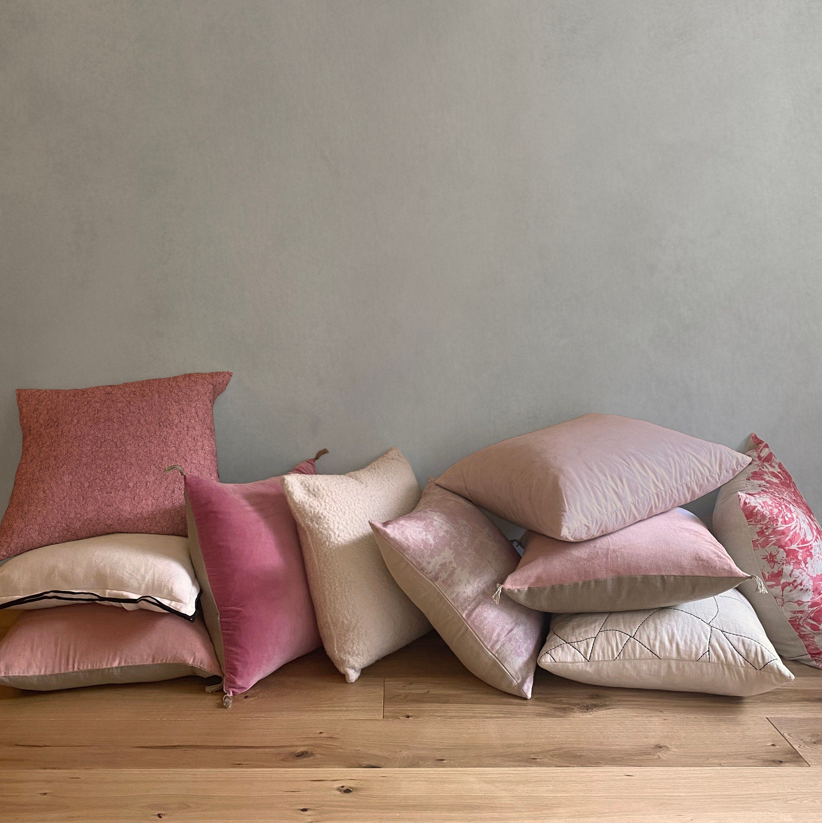 Dusty pink store cushions and throws